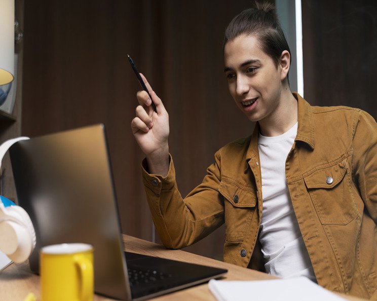 teenage-boy-having-video-call-home-laptop (1)